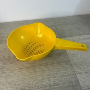 Vintage yellow Tupperware strainer